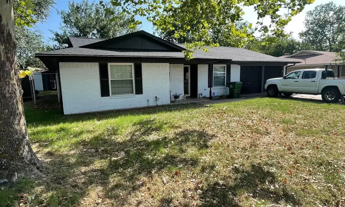 Professional roofing crew working on a residential roof in Troutdale